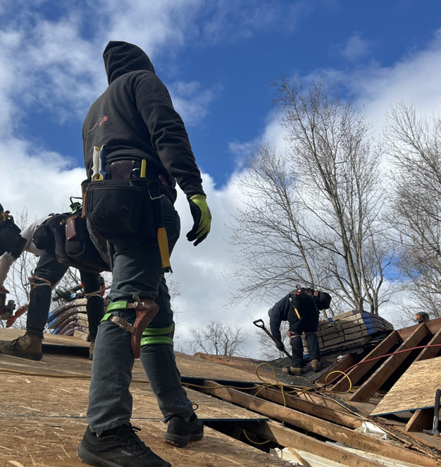 Roofing crew working on tear-off